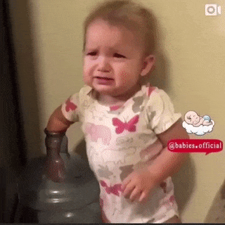 Baby and hand in bottle