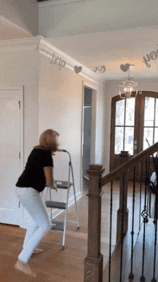 Baby flies with balloons