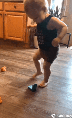 Child tries to sit on mini toilet bowl