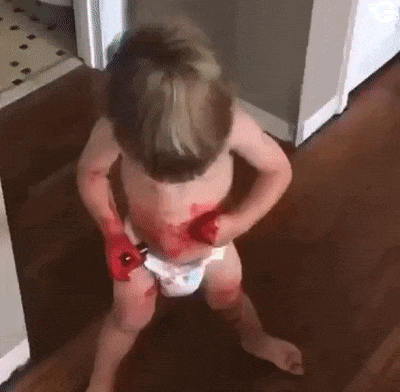 Child with lipstick and baby