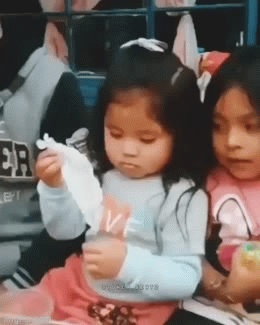 Little girl magician and middle finger