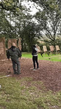 Girl throws the axe
