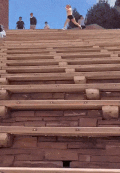 Girl runs across the stands
