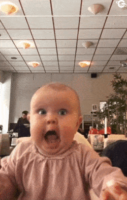 Hungry baby and reaction to food