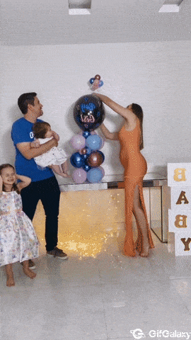 Father jumping with baby