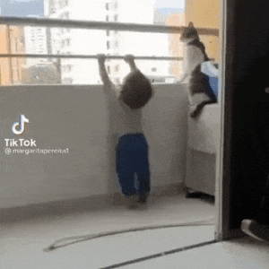Cat looks after child