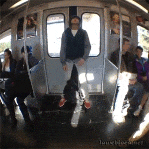 Guy sleeps at train door