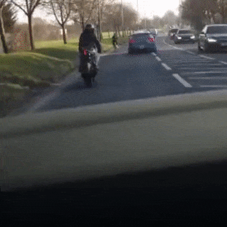 Motorcyclist imitates cyclist