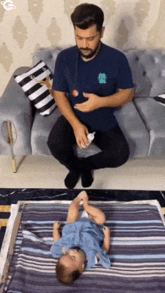 Father feeds baby