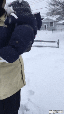 Father and baby in snow