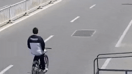Hands in pockets and cycling