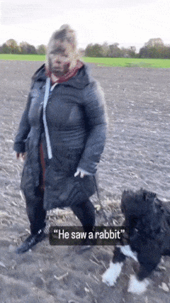 Woman takes dog for walk