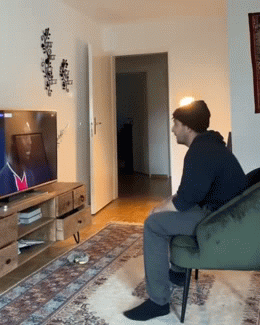 Guy watching football and a girl