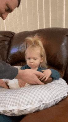 Little girl takes care brother