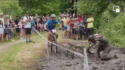 Cyclist falls into the mud