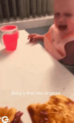 Child eats pizza first time