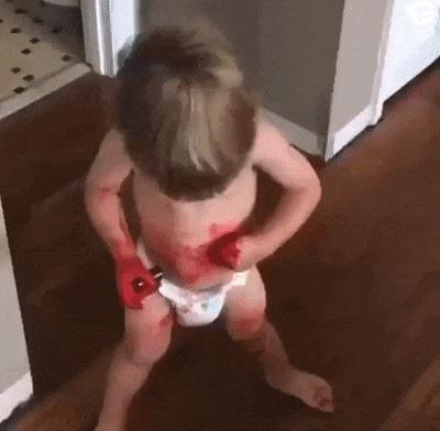 Child with lipstick and baby