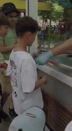 Boy and an ice cream seller