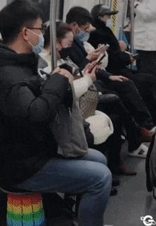 Kind guy on train with folding chair