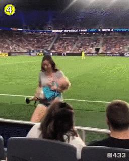 Mother and child on football match