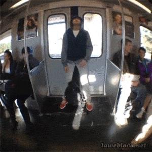 Guy sleeps at train door