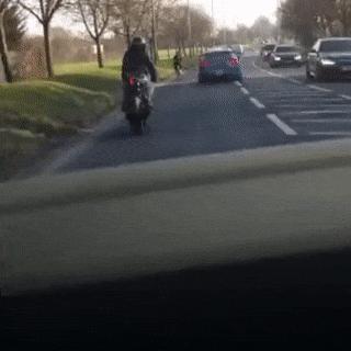 Motorcyclist imitates cyclist