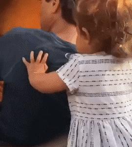 Father and little girl on slide