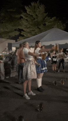 Winner in holding pint of beer
