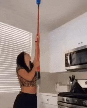 Trick with glass of water and broom